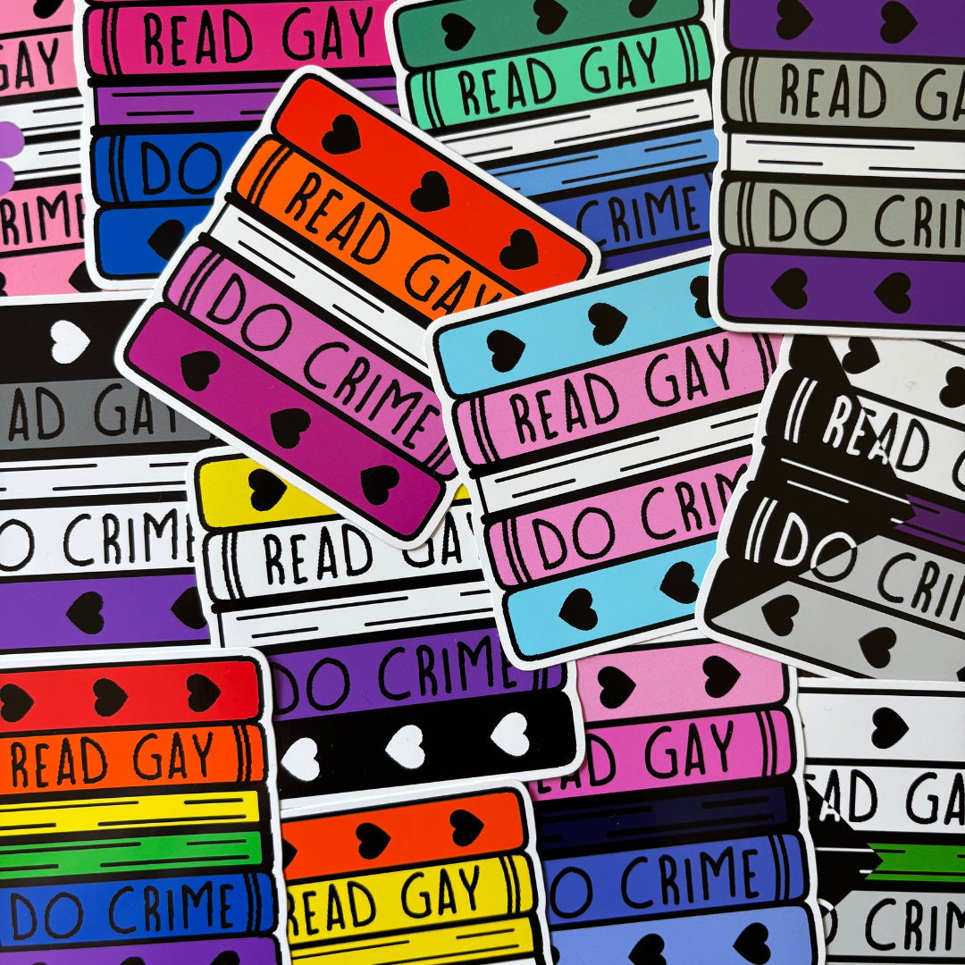 A dense collage of colourful stickers featuring the words 'READ GAY DO CRIME' in bold lettering. The stickers are shaped like stacks of books and are coloured in the colours of various pride flags.