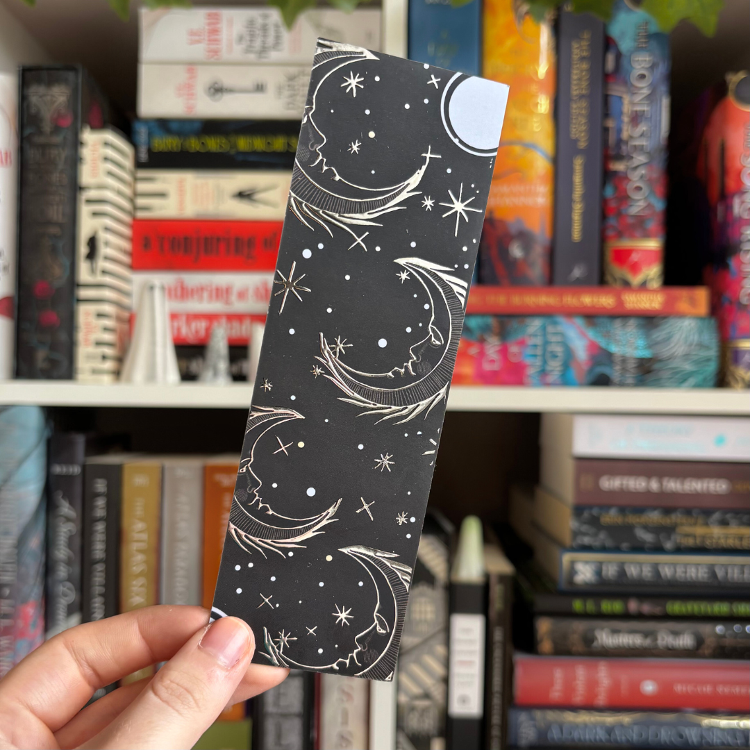 Black bookmark with foiled sun, moon, and stars designs