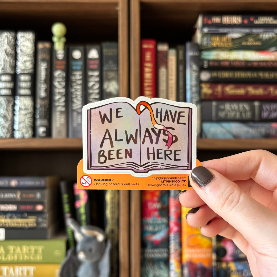 Book-shaped sticker with the text "We have always been here" decorated in colours of various pride flags