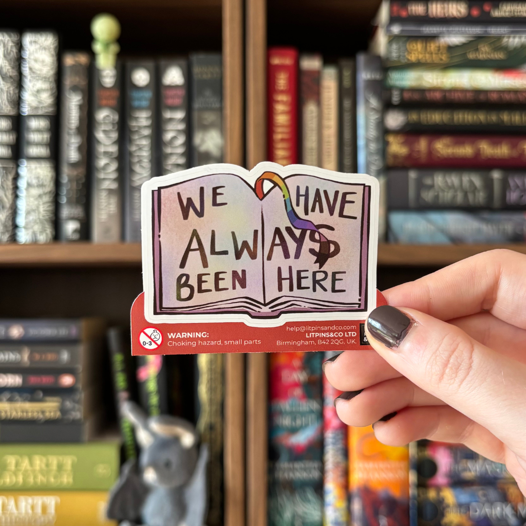 Book-shaped sticker with the text "We have always been here" decorated in colours of various pride flags