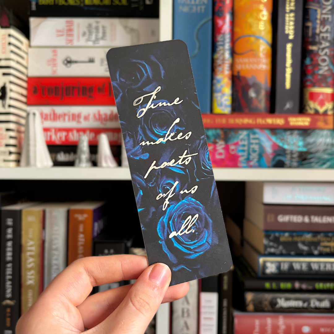 Blue floral bookmark inspired by V. E. Schwab's Bury Our Bones in the Midnight Soil, with foiled text reading "Time makes poets of us all."