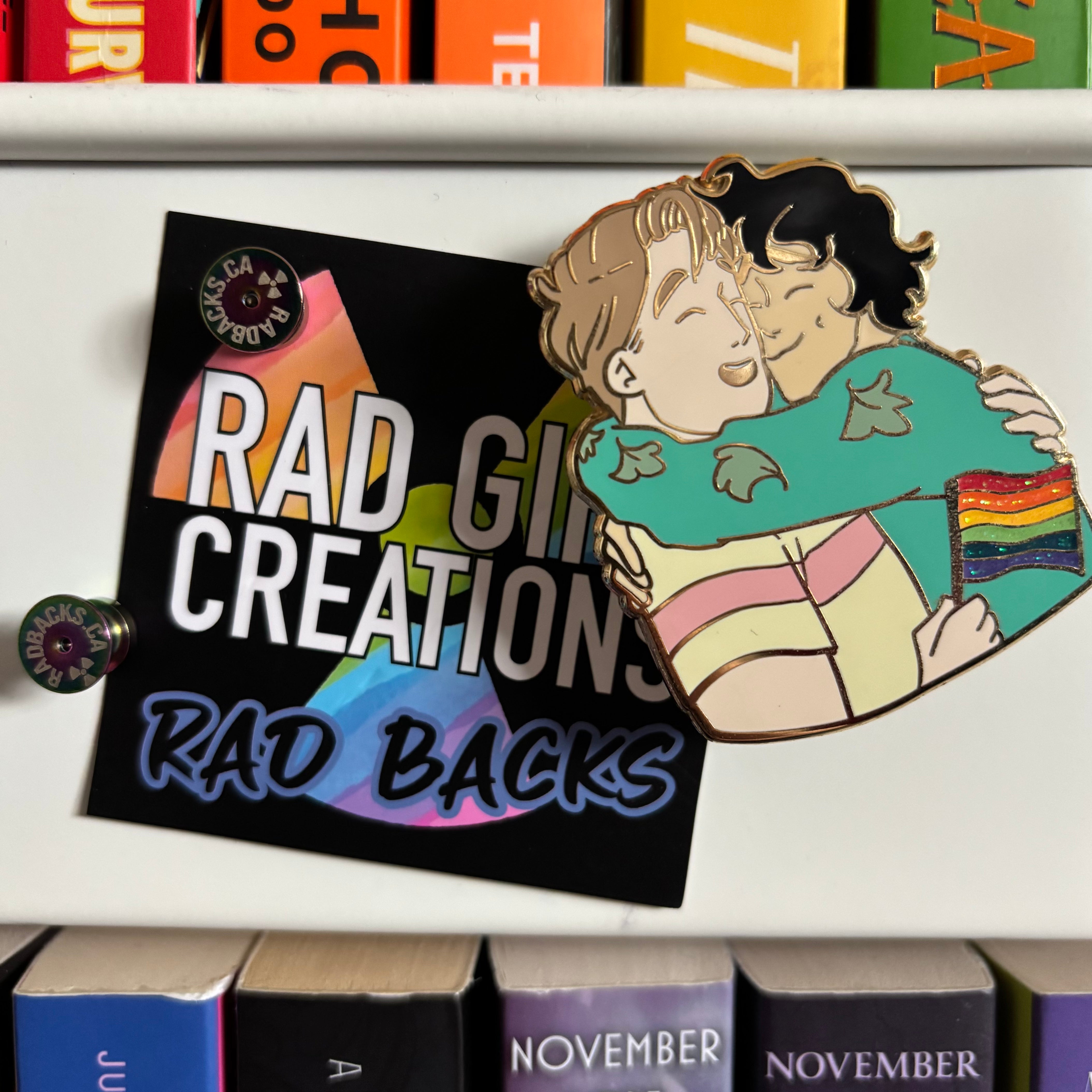 Our Heartstopper Pride Pin being used as a magnet, with Rad Girl Creations Rad Backs