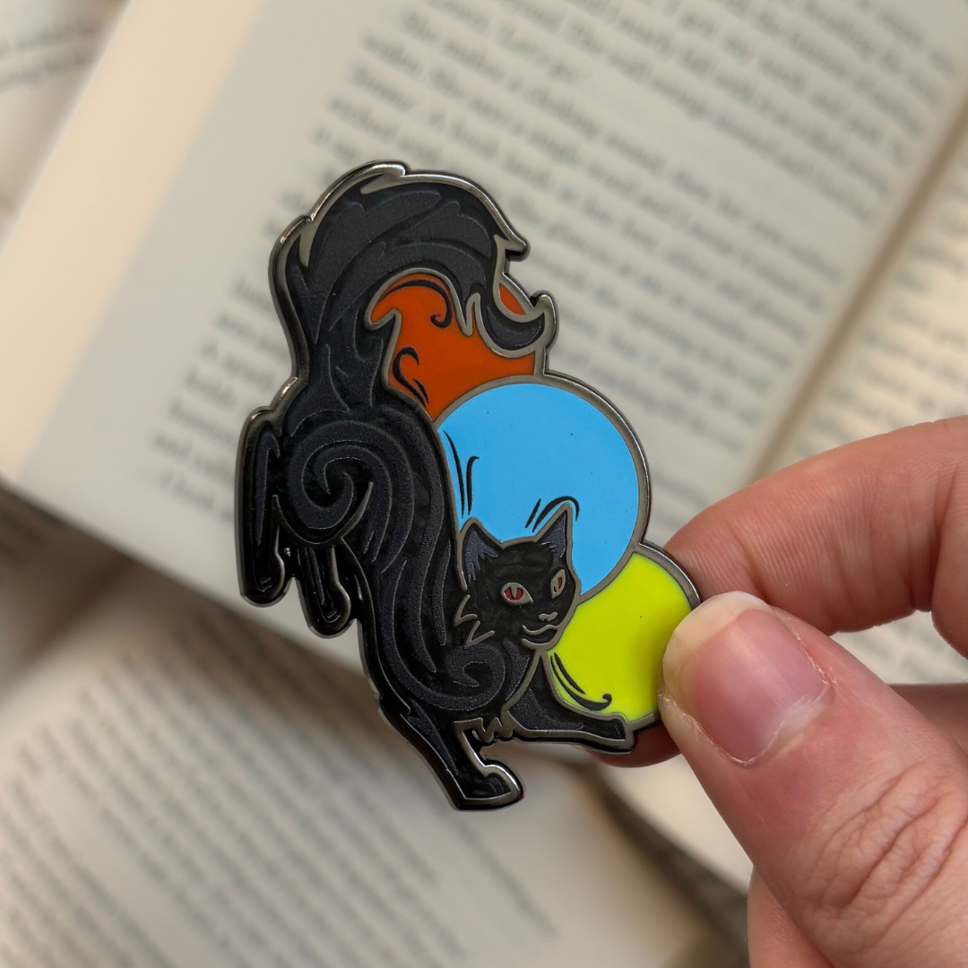 Enamel pin of a black cat, inspired by Mister Kindly from Nevernight by Jay Kristoff
