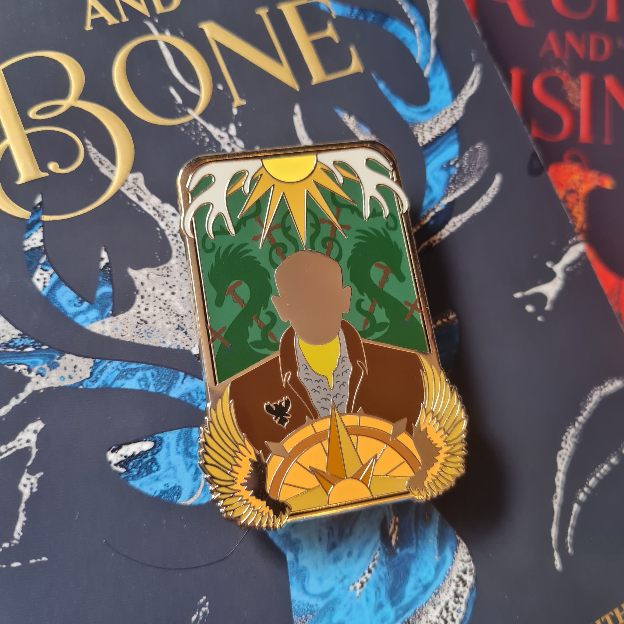 The Tracker Shadow and Bone Enamel Pin