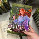 The LitPins&Co special edition of Immortal Game by Alison Saft, featuring a red-haired woman on a green cover