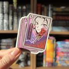 Book shaped sticker inspired by the manga genre, featuring a manga inspired character drawing