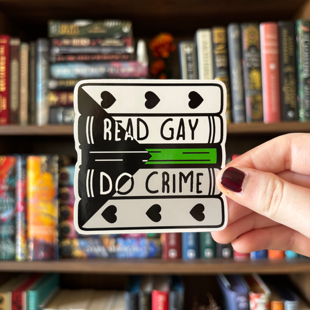 A large sticker designed to look like a stack of books in the colours of the demiromantic pride flag, with text reading "Read Gay Do Crime"