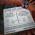 Rad Girl Creations Rad Backs Official Guide to Attach and Remove the Rad Back Pin Backs Card with a stack of radbacks on top.