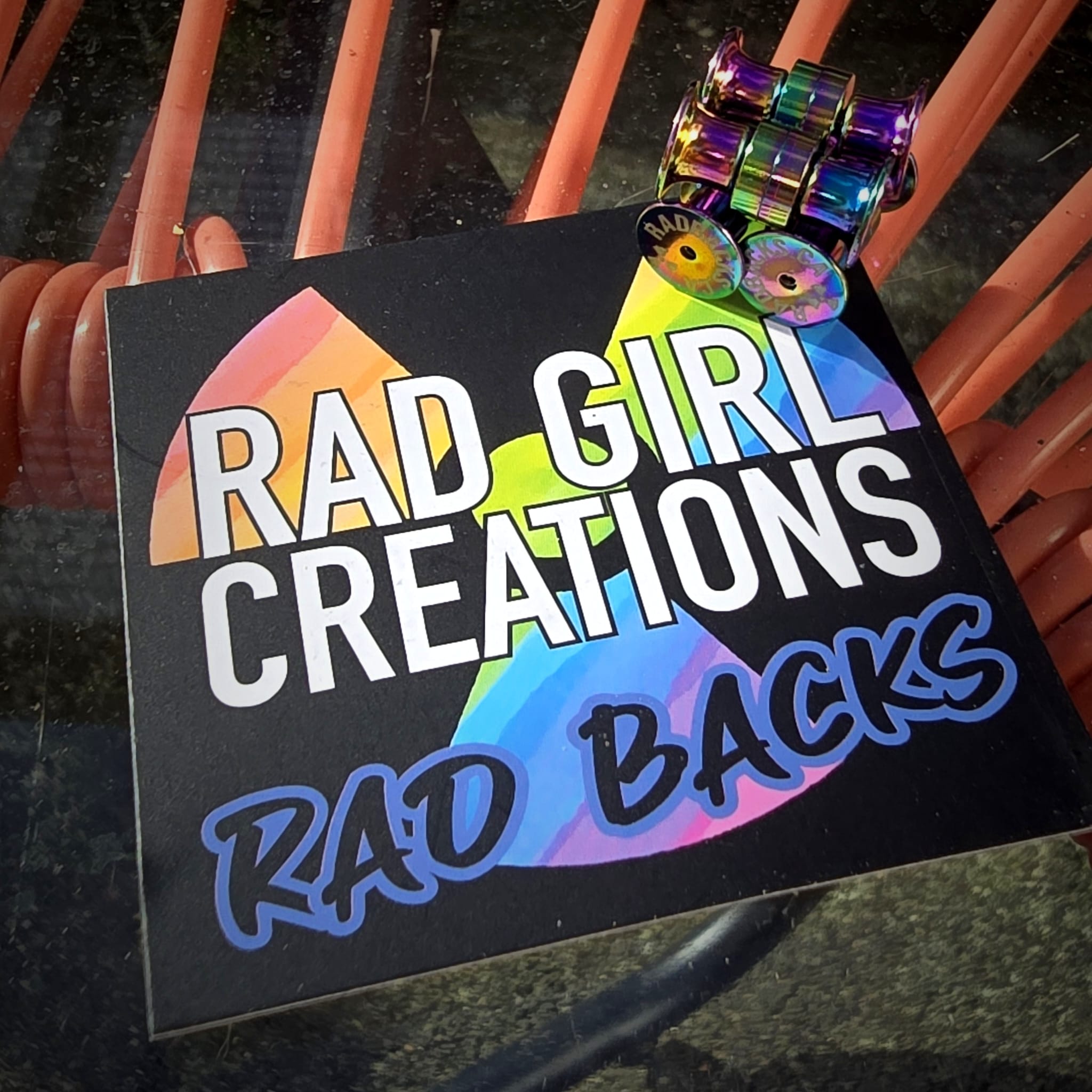 The Rad Girl Creations Rad Back Card with the physical radbacks stacked on top.