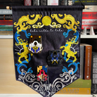 Pin banner inspired by Shadow and Bone, decorated with sun and moon themed embroidery and the quote "Like calls to like"