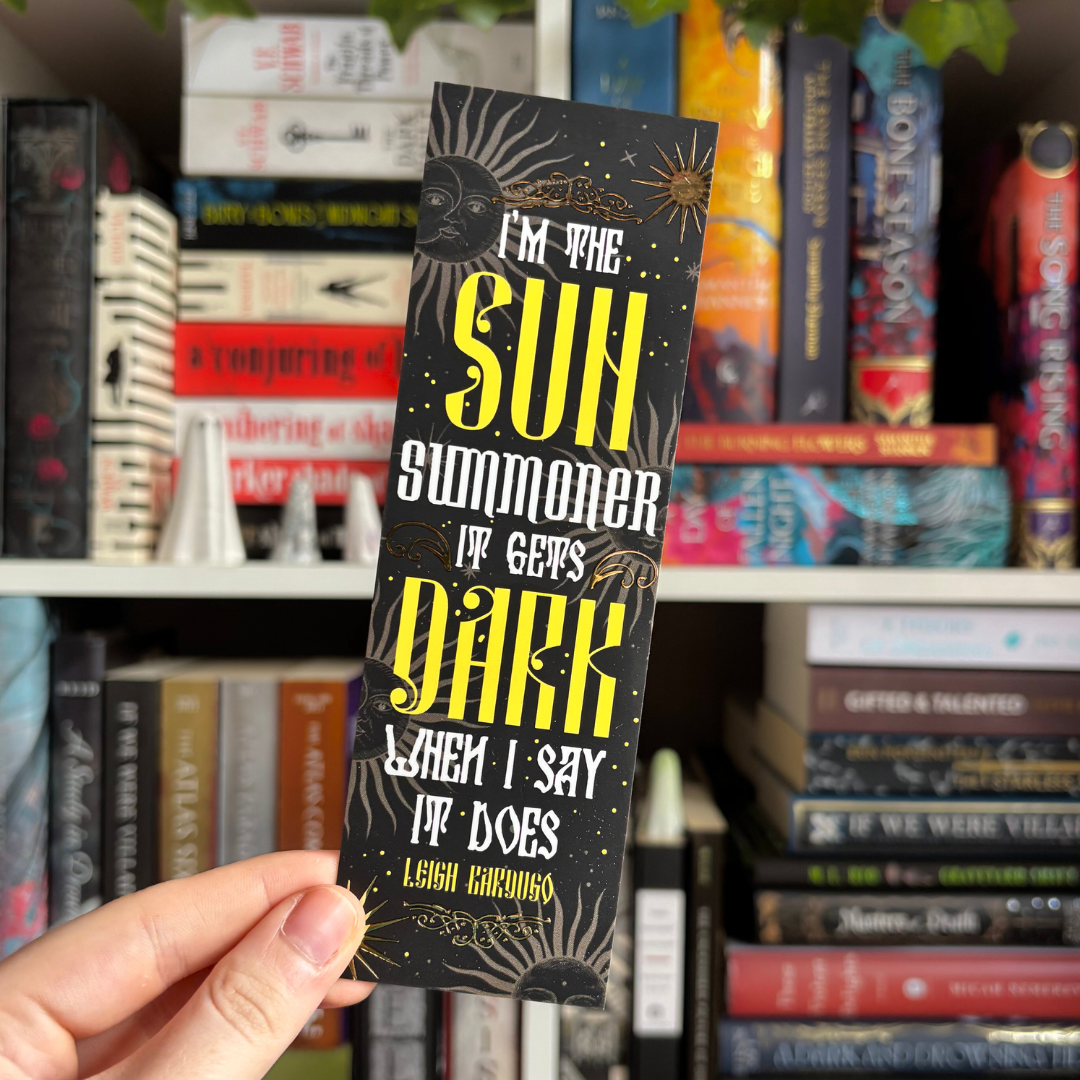 Black foiled bookmark inspired by Leigh Bardugo's Grishaverse series, featuring the quote "I'm the sun summoner. It gets dark when I say it does"