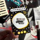 Enamel pin inspired by V.E. Schwab's Vicious, featuring the quote "Victor Vale was not a ******* sidekick"