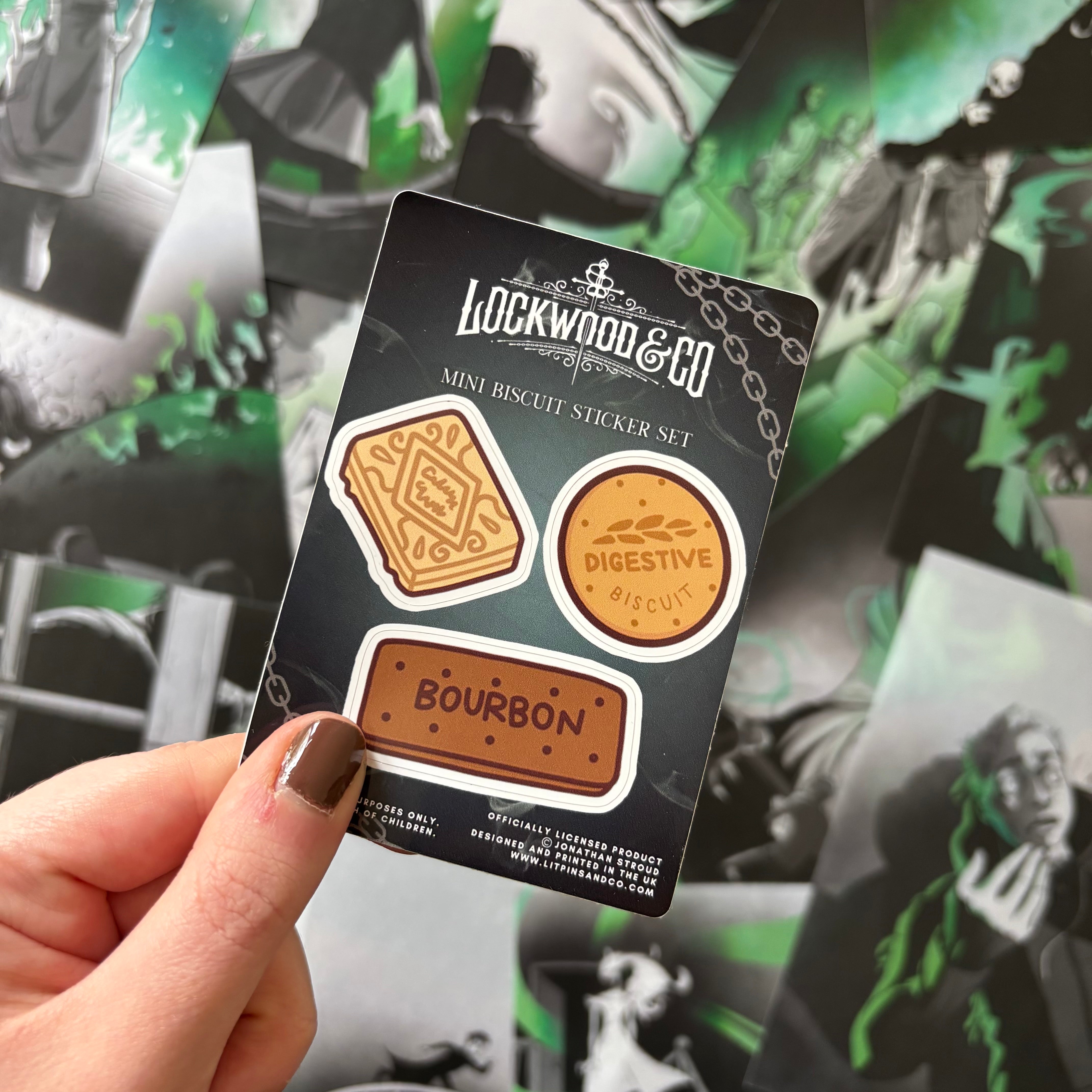 Hand holding a 'Lockwood & Co' mini biscuit sticker set 