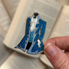 Enamel pin inspired by Dior's Coat, from Empire of the Vampire by Jay Kristoff