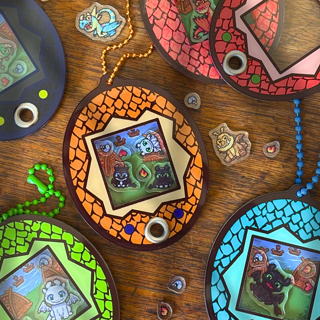 Colourful shaker keychains with dragon charms inspired by HTTYD