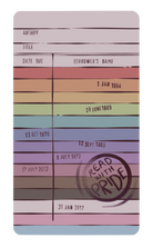 Rainbow coloured library card sticker with text and a 'Read with Pride' stamp