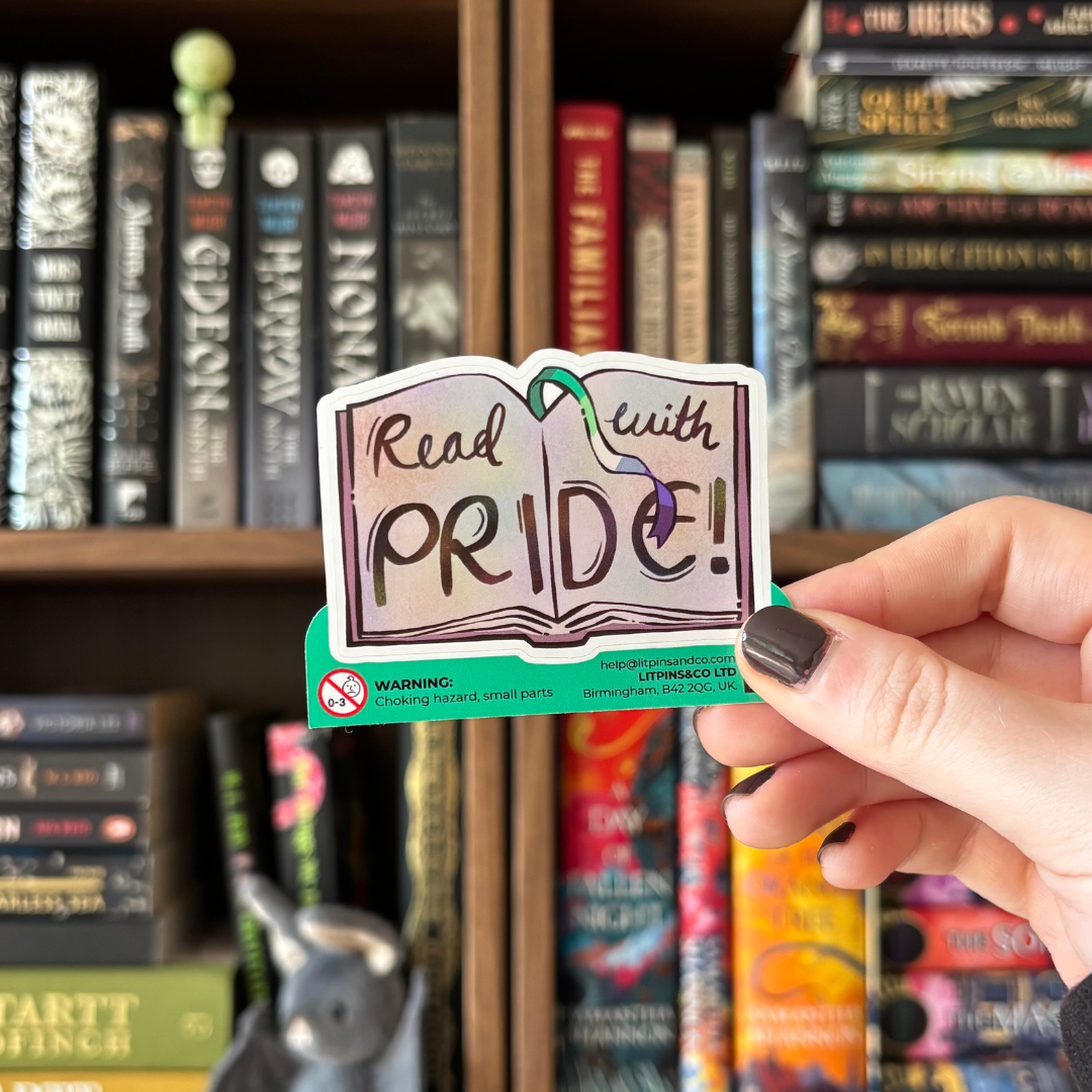 Book-shaped sticker with the text "Read with pride" decorated in colours of various pride flags