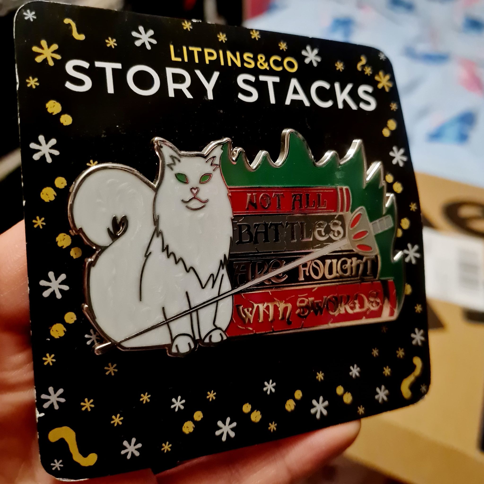 "Not all battles are fought with swords." Enamel Pin inspired by Margaret Rogerson's Sorcery of Thorns featuring LitPins&Co Story Stack backing card.