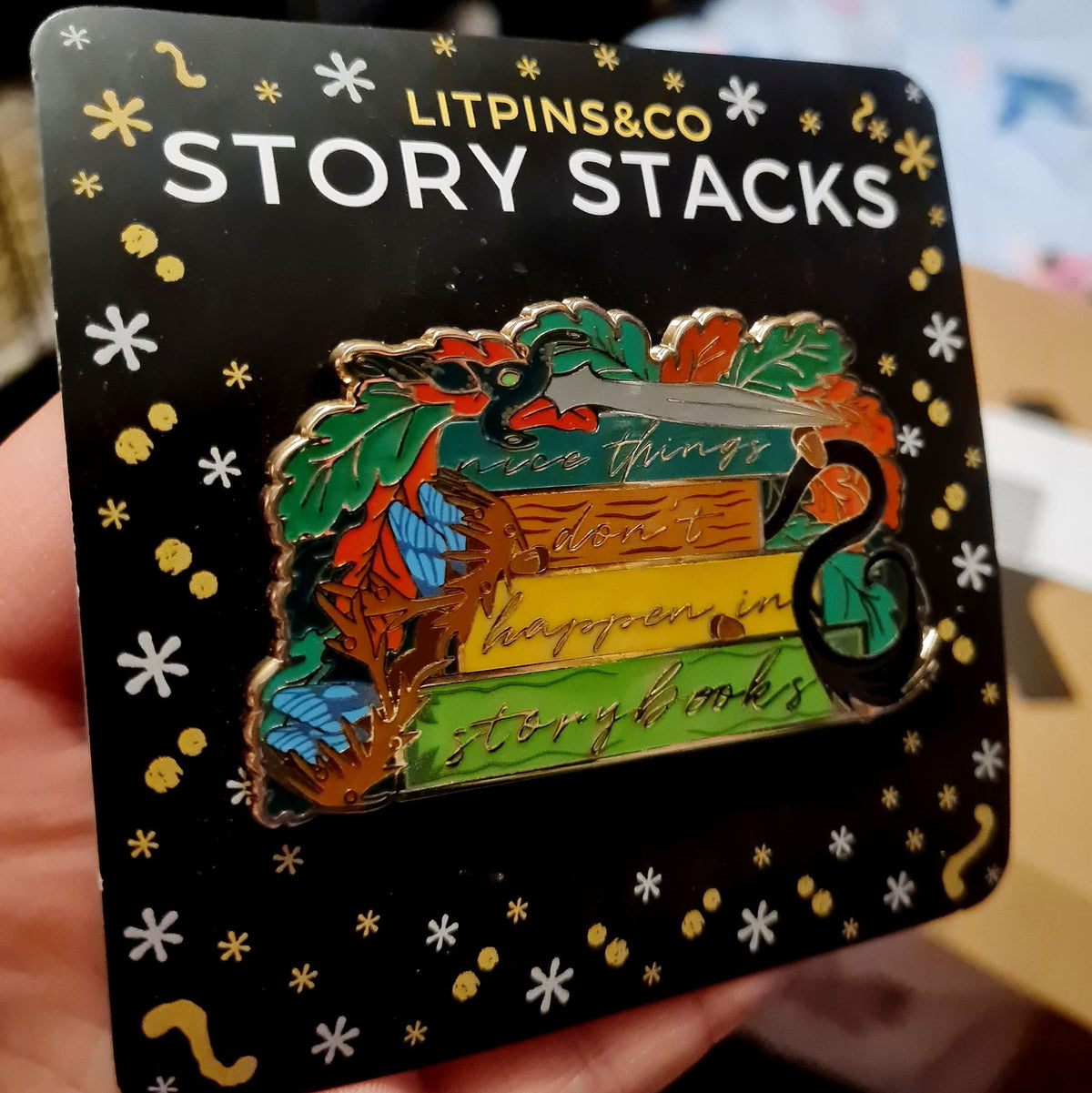 The Cruel Prince by Holly Black Story Stack Enamel Pin against the LitPins&amp;Co backing card.