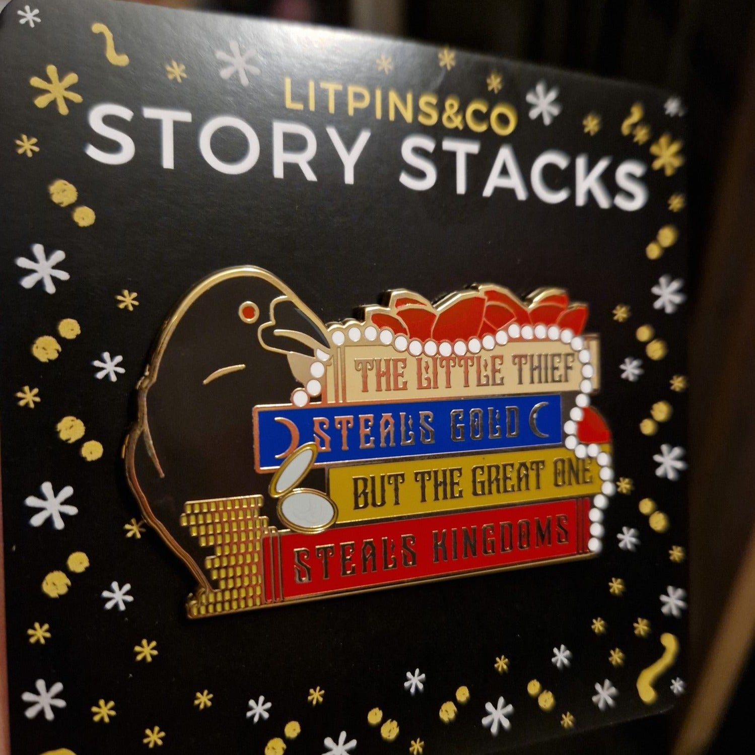 "The Little Thief Steals Gold But The Great One Steals Kingdoms." Enamel pin inspired by Marget Owen on a LitPins&Co Story Stack backing card.