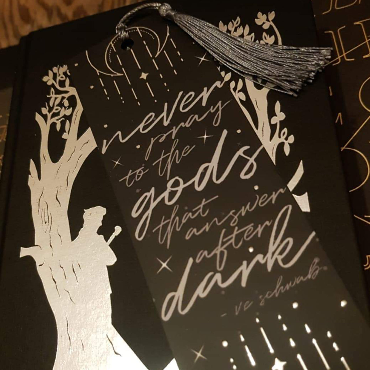 Never Pray, The Invisible Life of Addie LaRue by V.E Schwab inspired bookmark with a silver tassel. 